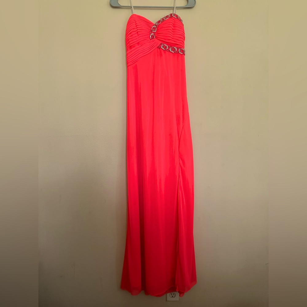 I am selling a neon oranges prom dress. Size 5. Off the shoulders and padded bra